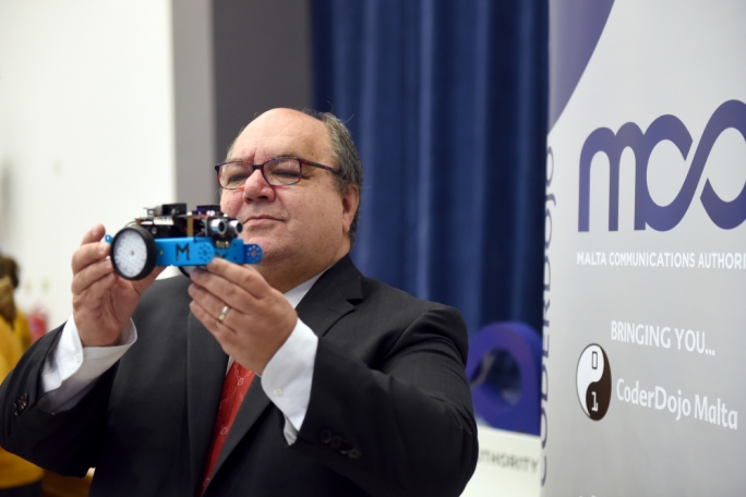 Minister Manuel Mallia inspecting a robot